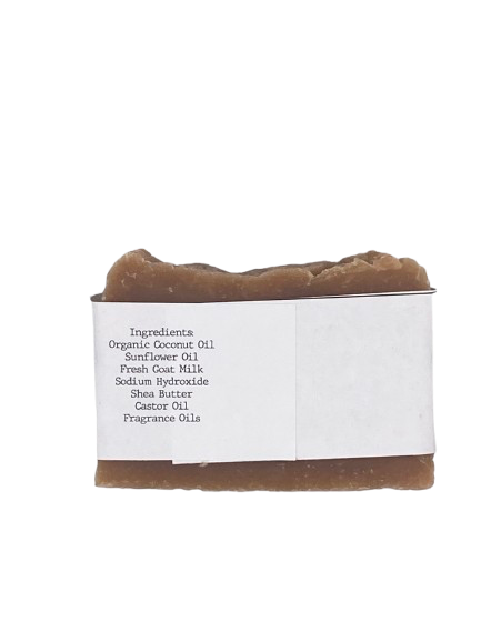 Goat milk soap bar wrapped in white belly band labeled ‘Bees Knees’ with honey fragrance
