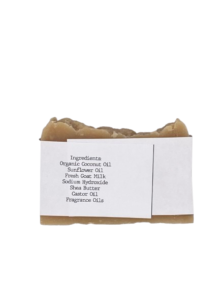 Bar of soap with a white label displaying ingredients on a white background