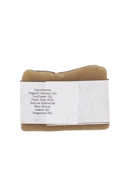 Bar of soap with a white label displaying ingredients on a white background