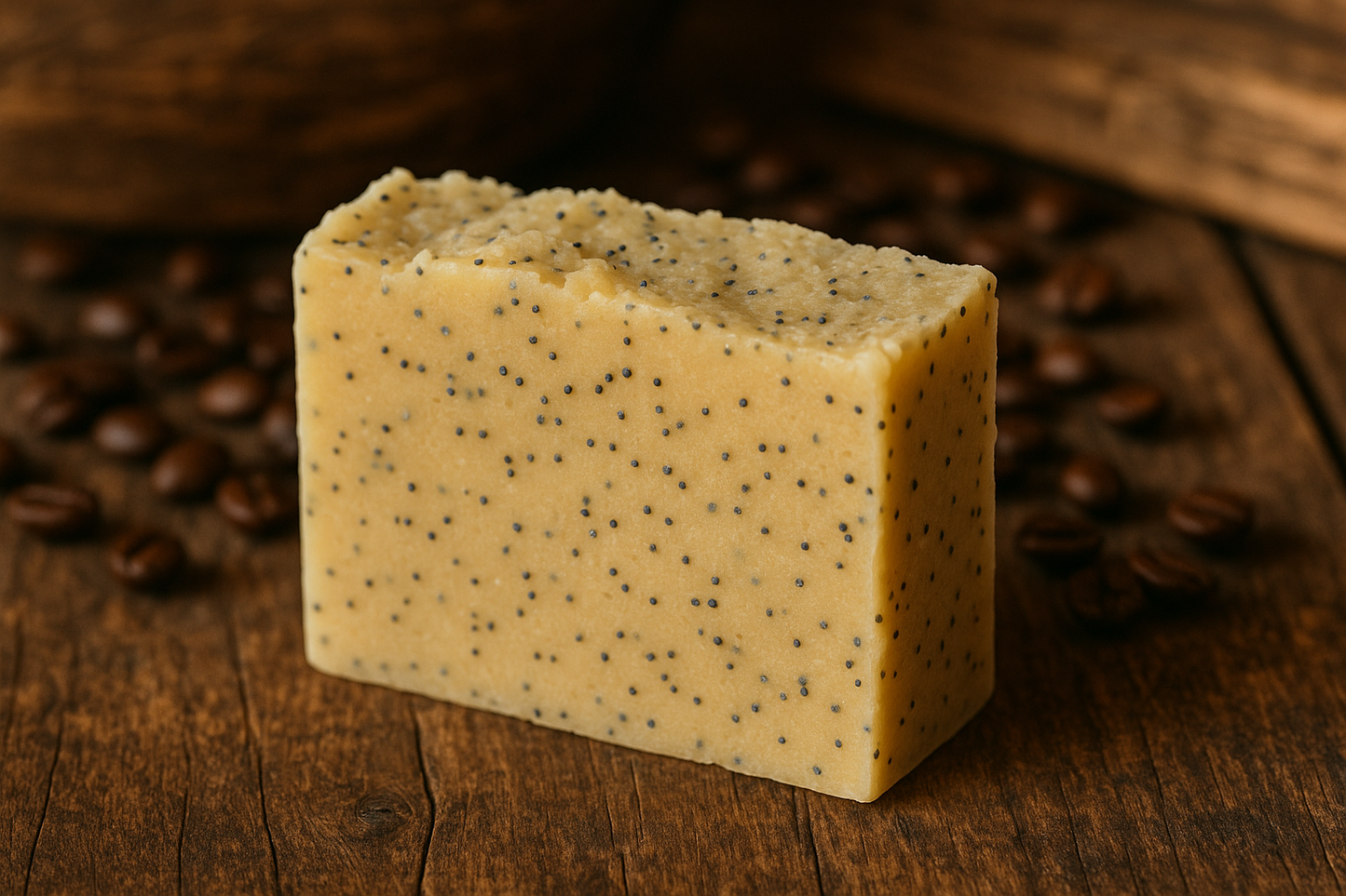Light yellow soap with poppyseeds, handmade bar with coffee and wood in background