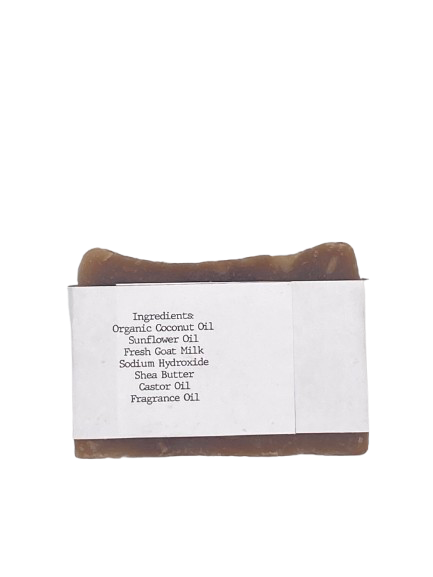 Bar of soap with a white label displaying ingredients on a white background