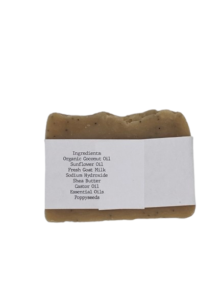 Bar of soap with a white label displaying ingredients on a white background