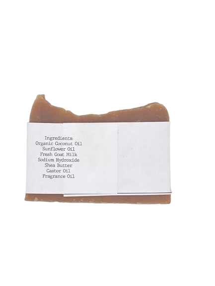 Bar of soap with a white label displaying ingredients on a white background